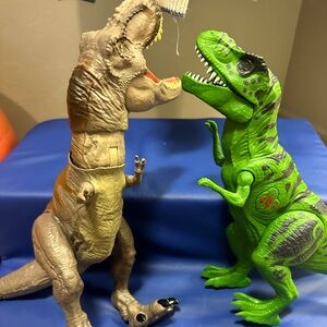 Two interactive Dino’s green and brown push buttons to make them come alive!